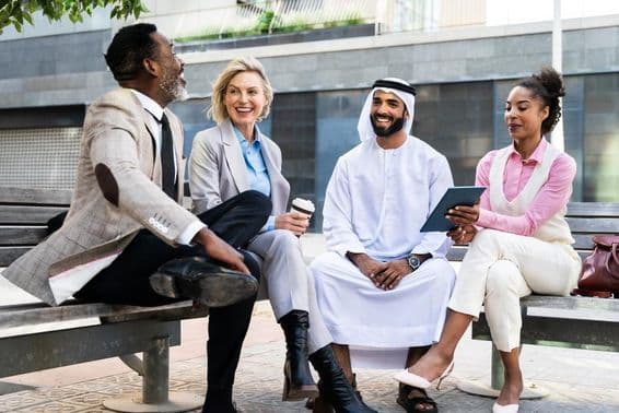 Group of businesspeople meeting with an Emirati businessman in Dubai.