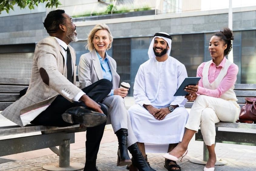 Group of businesspeople meeting with an Emirati businessman in Dubai.