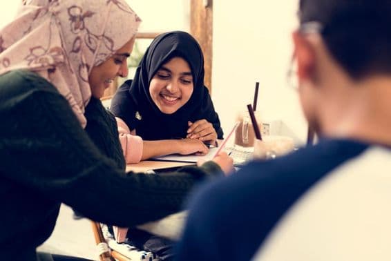 Muslim students studying in a classroom.