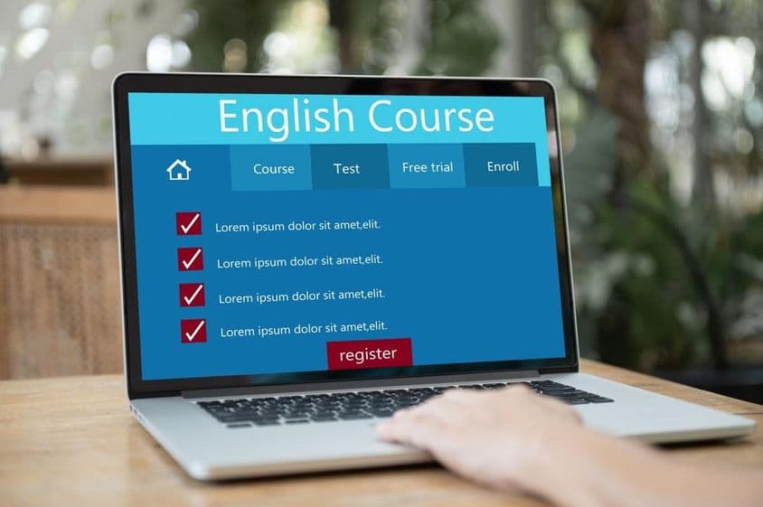 Learning English with laptop and AI assistance.