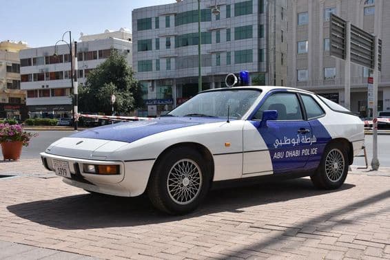 Abu Dhabi police classic car exhibit, blue and white patrol car.