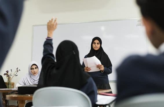 Muslim children studying in a classroom.