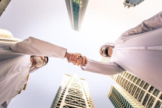 Business people meeting outdoors in Dubai, United Arab Emirates.