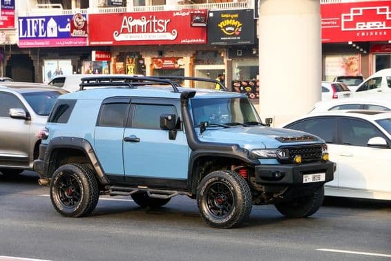 Off-road car Toyota FJ Cruiser in city street.