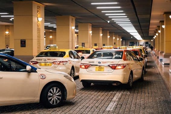 Taxi cars parked at a shopping mall in Dubai.