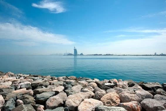 View of Dubai from the Palm Jumeirah, overlooking the Burj Al Arab.