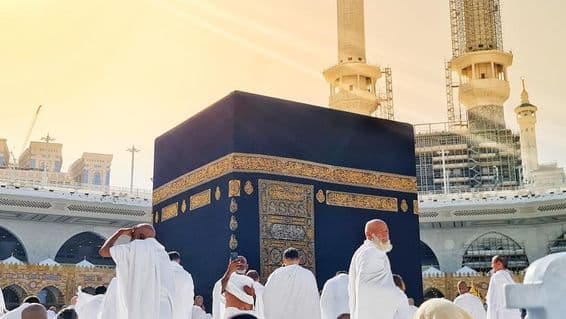 Umrah pilgrims performing tawaf around the Kaaba.