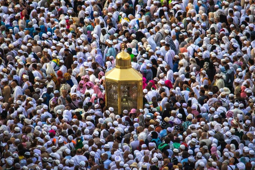 Muslim pilgrims walking past the sacred site of Abraham.