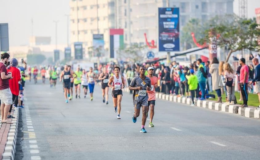 Marathon runners and winners during a street course half marathon.