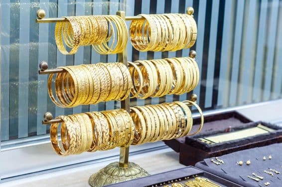 Gold bracelets for sale in a jewelry store.