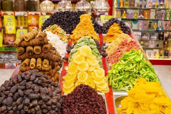 Dry tropical fruits displayed in a souvenir shop in Dubai.