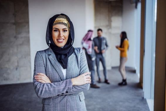 Successful Arab female investor in a skyscraper under construction.