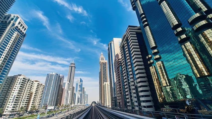 Dubai cityscape, buildings, skyscrapers, roads.