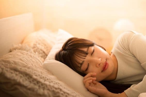 A woman sleeping in bed.