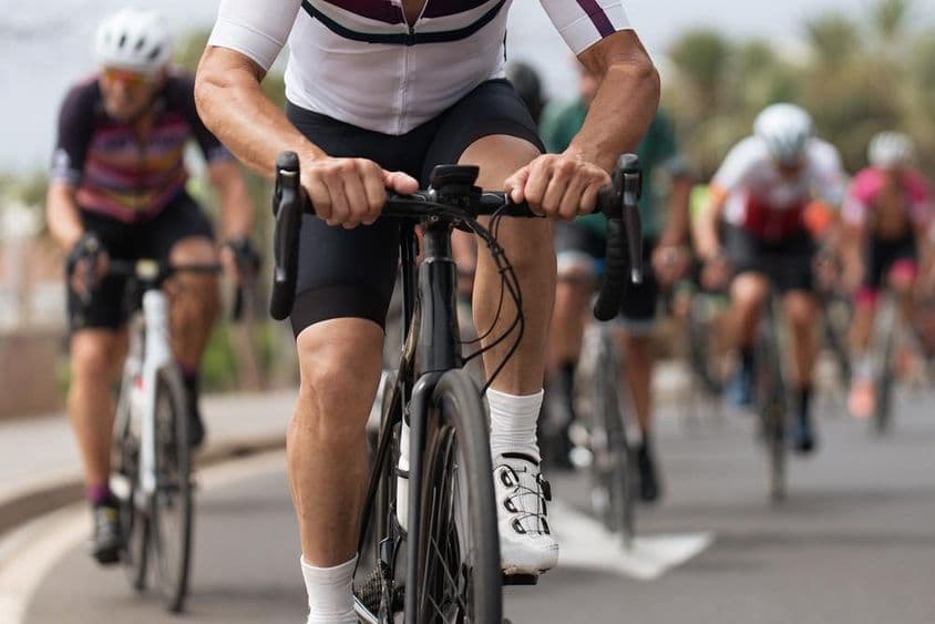 Cyclist athletes competing on a street.