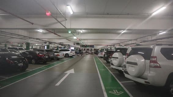 Cars parked in a Dubai parking garage.
