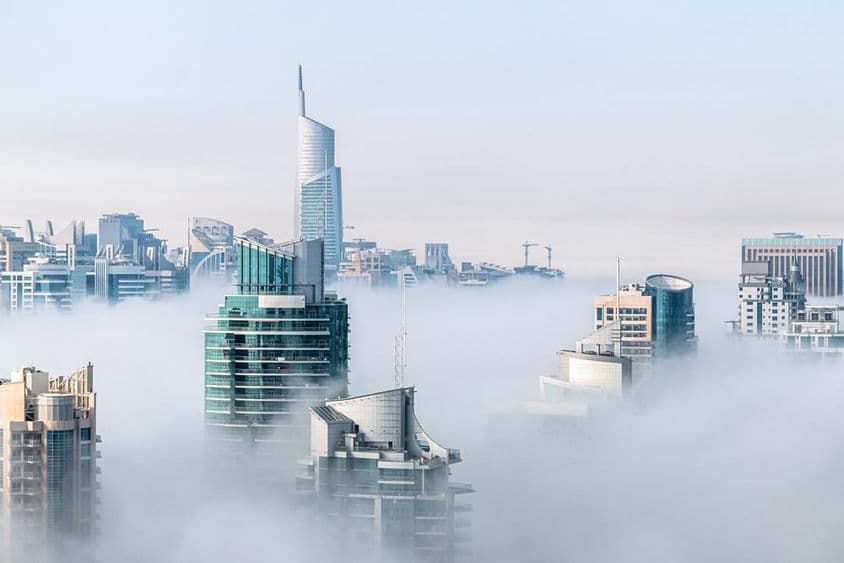 Morning fog among skyscrapers.