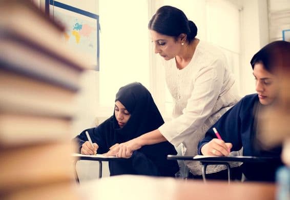 Muslim girls studying in a classroom.