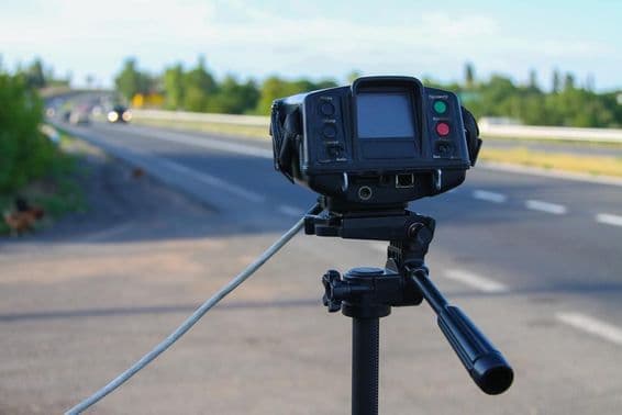 Police radar measuring car speed.