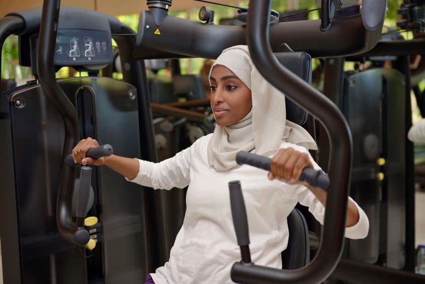 Young woman working out in a gym.