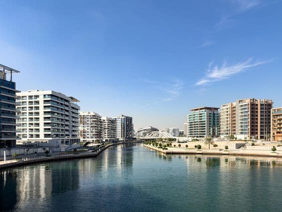 Residential buildings and canal in the Al Raha Beach neighborhood and community in Abu Dhabi.