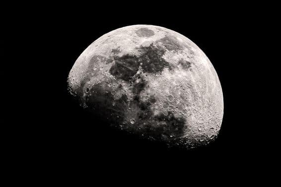 Astronomical photograph of the Moon showing detailed craters and surface.