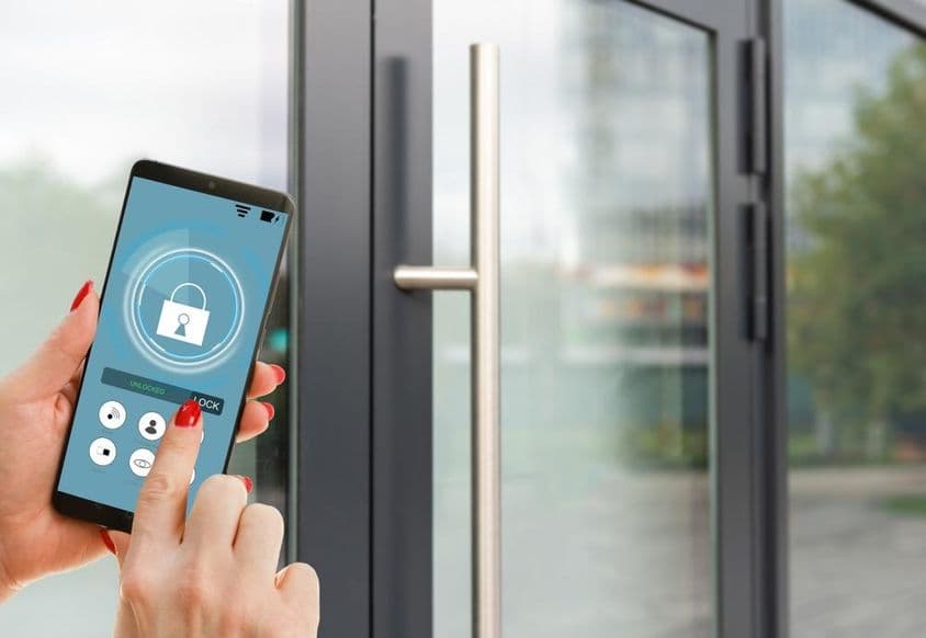Smartphone displaying smart home application on screen.