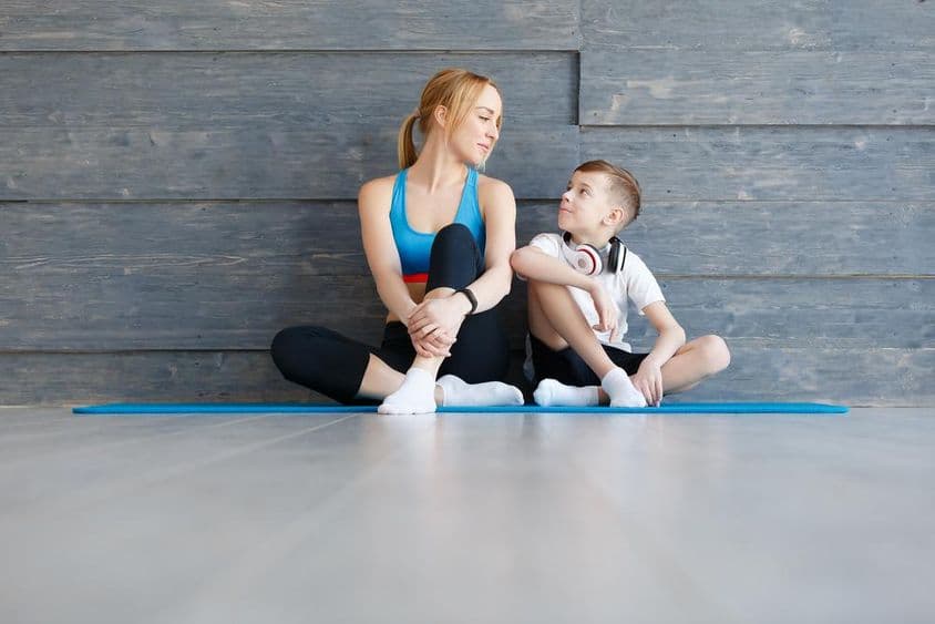 Mother and child doing exercises together.