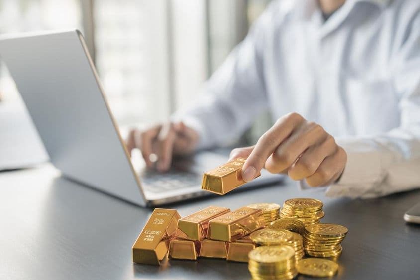 Investment gold in a person's hand.