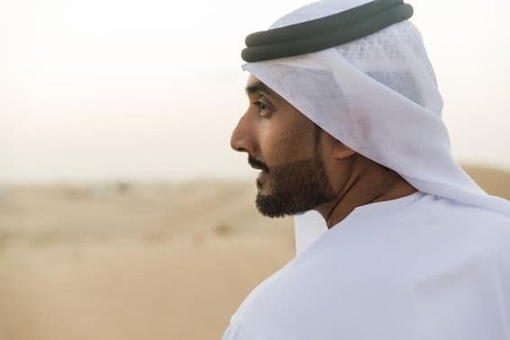 Muslim businessman from Dubai in traditional attire.