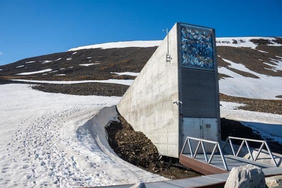 The entrance building of the Svalbard Global Seed Vault surrounded by snow in Svalbard, Norway.