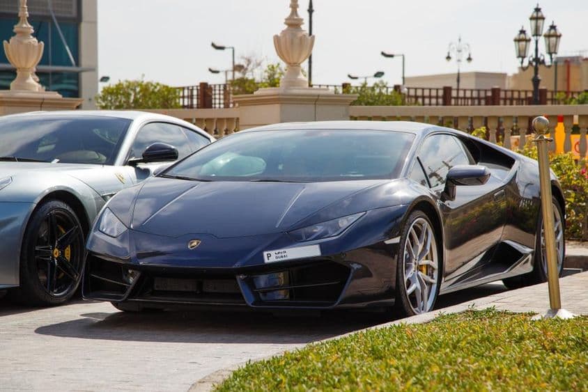 Dubai, black Lamborghini in parking lot.