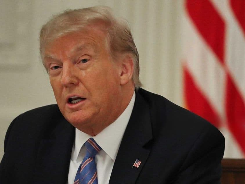 Donald Trump speaking at an event.