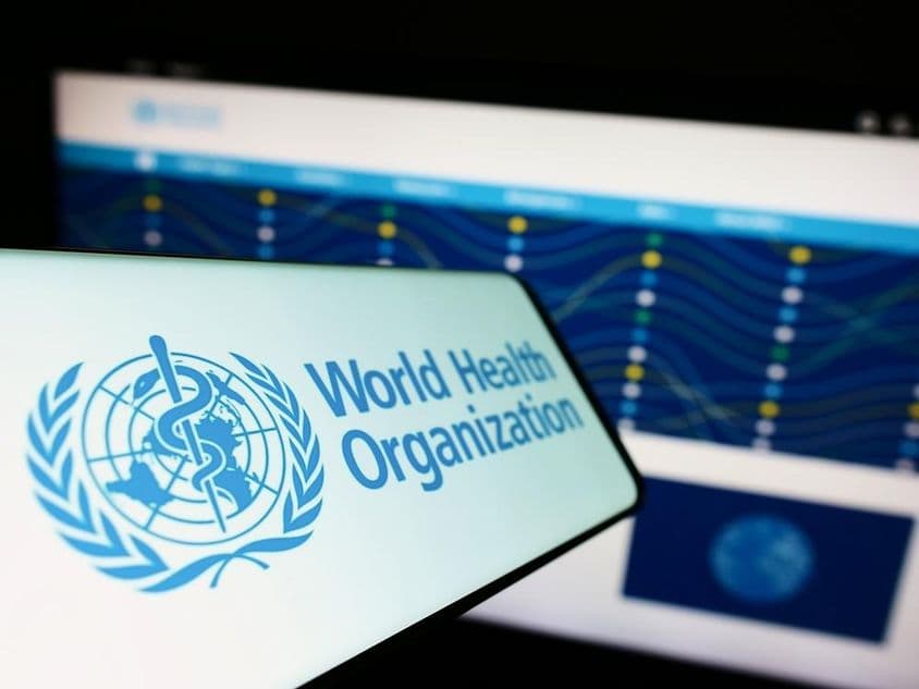 Phone with United Nations World Health Organization (WHO) logo.