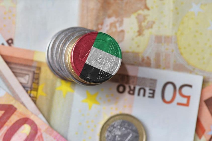 Flag of the United Arab Emirates, euro currency banknotes.