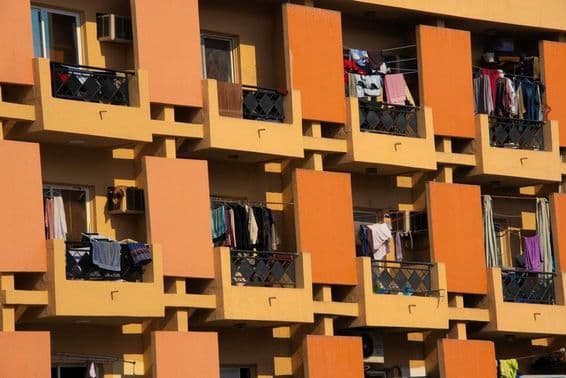 Apartment building in Dubai with clothes drying on balconies.