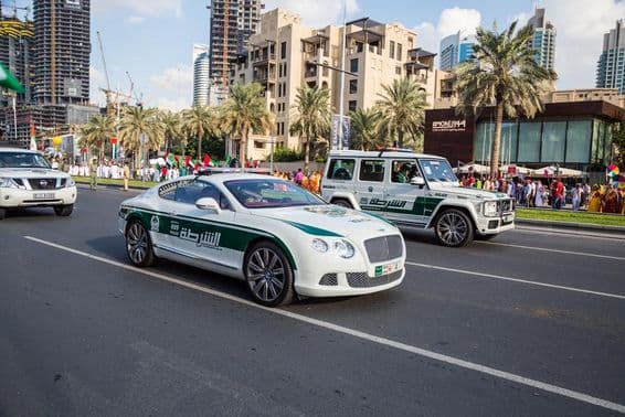 Police car parade along Mohammed Bin Rashid Boulevard in downtown Dubai.