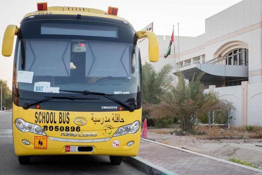 Yellow school bus in Abu Dhabi, United Arab Emirates.