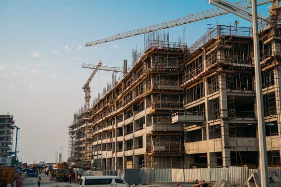 Modern construction with industrial cranes in Dubai.
