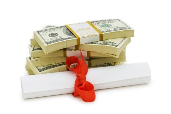 Expensive education, dollar bills and diploma.