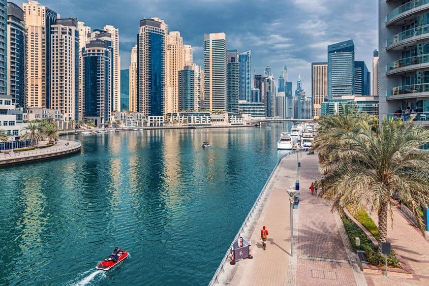 Dubai Marina district with high-rise skyscrapers and commercial and residential properties.
