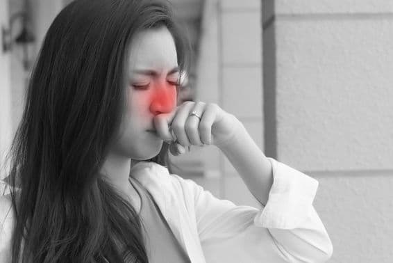 Young adult Asian woman with influenza illness.