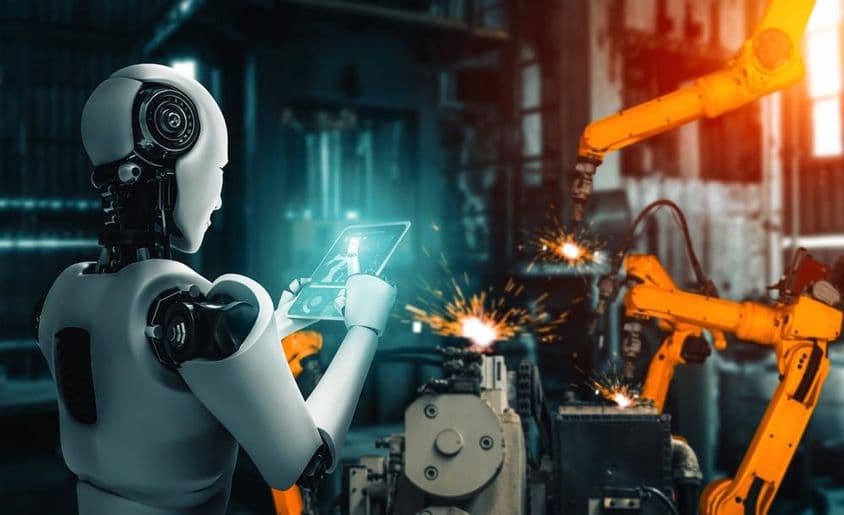Artificial intelligence overseeing robotic arms during an assembly process on the production line.