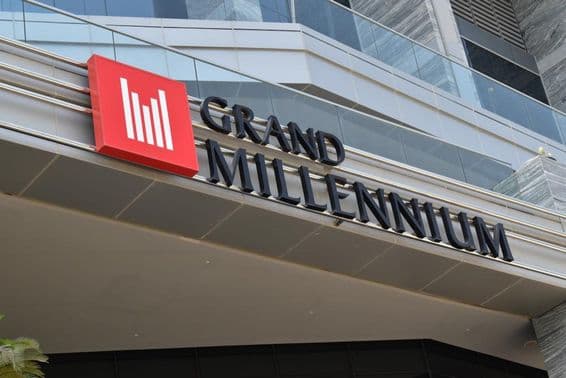 Facade of the Grand Millennium Hotel.