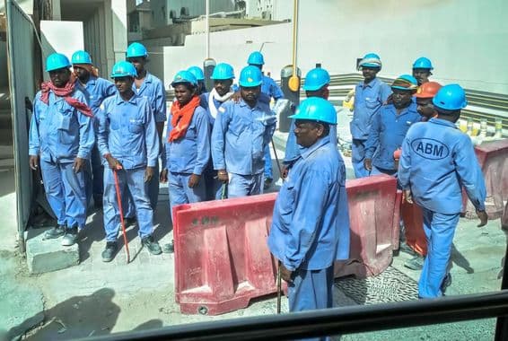 Asian workers in Dubai on a construction site.