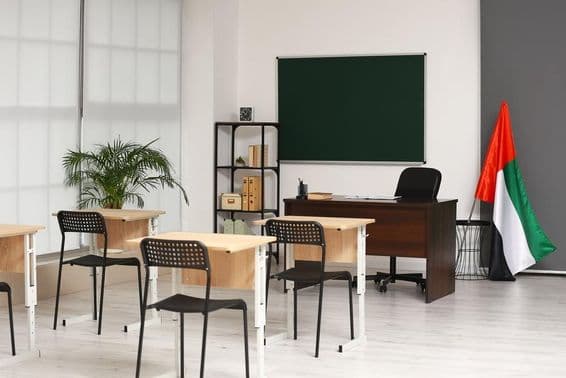 Interior of a classroom with the United Arab Emirates flag.