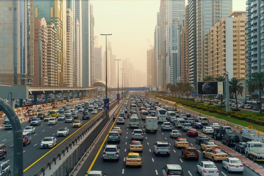 Traffic jam in downtown Dubai among skyscrapers.