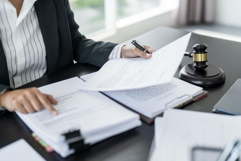 Judge's gavel, legal documents.