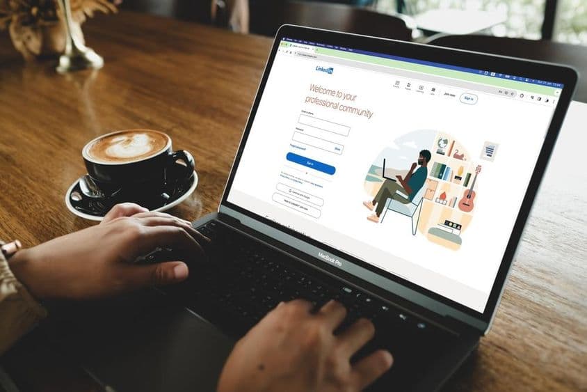 A person opening LinkedIn login page on a MacBook.