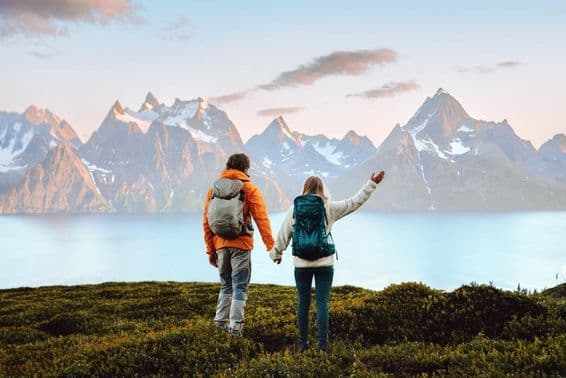 A pair hiking in Norway for an active vacation and healthy lifestyle.